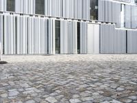 this is an image of an empty walkway between two buildings in front of the door