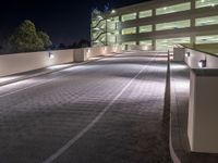 a view of a road and an overpass with traffic passing through it by buildings