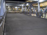 a view of a road and an overpass with traffic passing through it by buildings