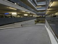 an empty walkway in an underground parking garage in the city of london, united kingdom of great britain