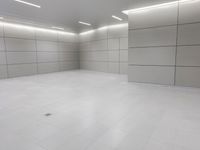 an empty floor is seen in this image and the flooring is all white and white