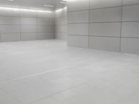 an empty floor is seen in this image and the flooring is all white and white