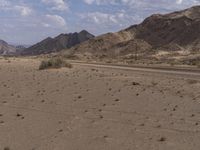 Endless Road in the African Desert: Sand Dunes and Mountains