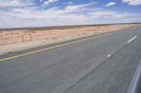 Endless Road in the Desert under a Clear Sky