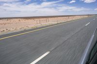 Endless Road in the Desert under a Clear Sky