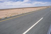 Endless Road in the Desert under a Clear Sky