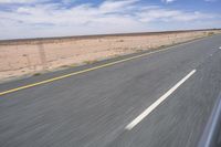 Endless Road in the Desert under a Clear Sky