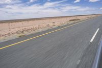 Endless Road in the Desert under a Clear Sky