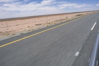 Endless Road in the Desert under a Clear Sky