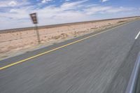 Endless Road in the Desert under a Clear Sky