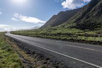 Endless Road Through Rural Landscape with Majestic Mountains