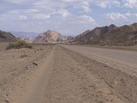 Endless Road Through Desert Mountain Range