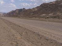 Endless Road Through Desert Mountain Range