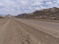 Endless Road Through Desert Mountain Range