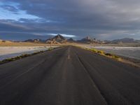 Endless Road through Utah Desert with Dramatic Mountains (002)