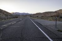 Endless Road in Utah Desert: A View of the Mountains