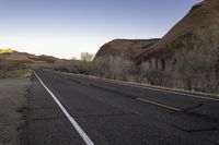 Endless Road through Utah's Red Rock at Dawn