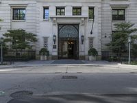 this is the entrance to a large apartment complex, with lots of windows and doors