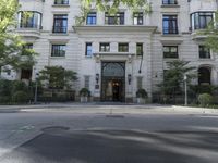this is the entrance to a large apartment complex, with lots of windows and doors