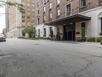 a view of the entrance to a large, brick building with a canopy that's over it