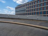 a car is driving on the highway through an underground parking garage area in a city