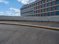 a car is driving on the highway through an underground parking garage area in a city