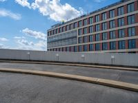 a car is driving on the highway through an underground parking garage area in a city