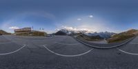 there is a circular lens effect on this street view of a mountain and sky behind