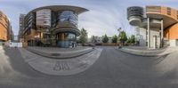 a fish eye view of a street in a large city with buildings on the side of it