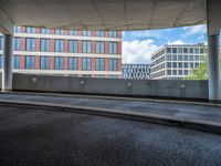 a car is driving on the highway through an underground parking garage area in a city