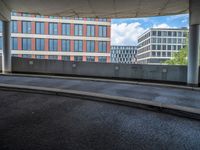 a car is driving on the highway through an underground parking garage area in a city