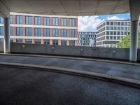 a car is driving on the highway through an underground parking garage area in a city