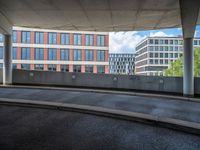 a car is driving on the highway through an underground parking garage area in a city