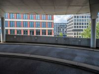 a car is driving on the highway through an underground parking garage area in a city