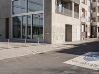 the sidewalk is empty and not in use for pedestrians to cross it or walk past the building