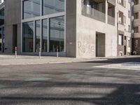 the sidewalk is empty and not in use for pedestrians to cross it or walk past the building