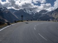 Highland Road in Europe with Trees and Clouds