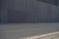 a person wearing a face mask walking across an empty street with a skateboard in the foreground