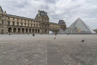 Europe's Palace: A Pyramid in Paris under a Grey Sky