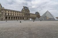 Europe's Palace: A Pyramid in Paris under a Grey Sky