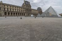 Europe's Palace: A Pyramid in Paris under a Grey Sky