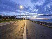 Europe's Portugal: A Coastal View of Lisbon's Bridge