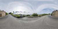 a fish eye view of a skateboard park with ramps and people standing on the ground looking up