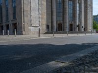 an entrance of a building with large columns and doors that spell out the word voltege