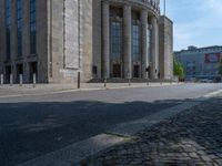 an entrance of a building with large columns and doors that spell out the word voltege