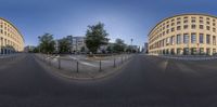 two panoramic photographs of a large building with a very long street between them