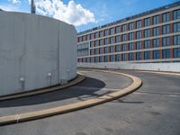 a car is driving on the highway through an underground parking garage area in a city