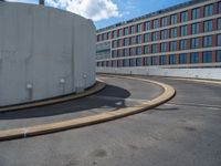 a car is driving on the highway through an underground parking garage area in a city