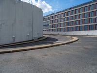 a car is driving on the highway through an underground parking garage area in a city