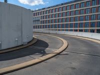 a car is driving on the highway through an underground parking garage area in a city